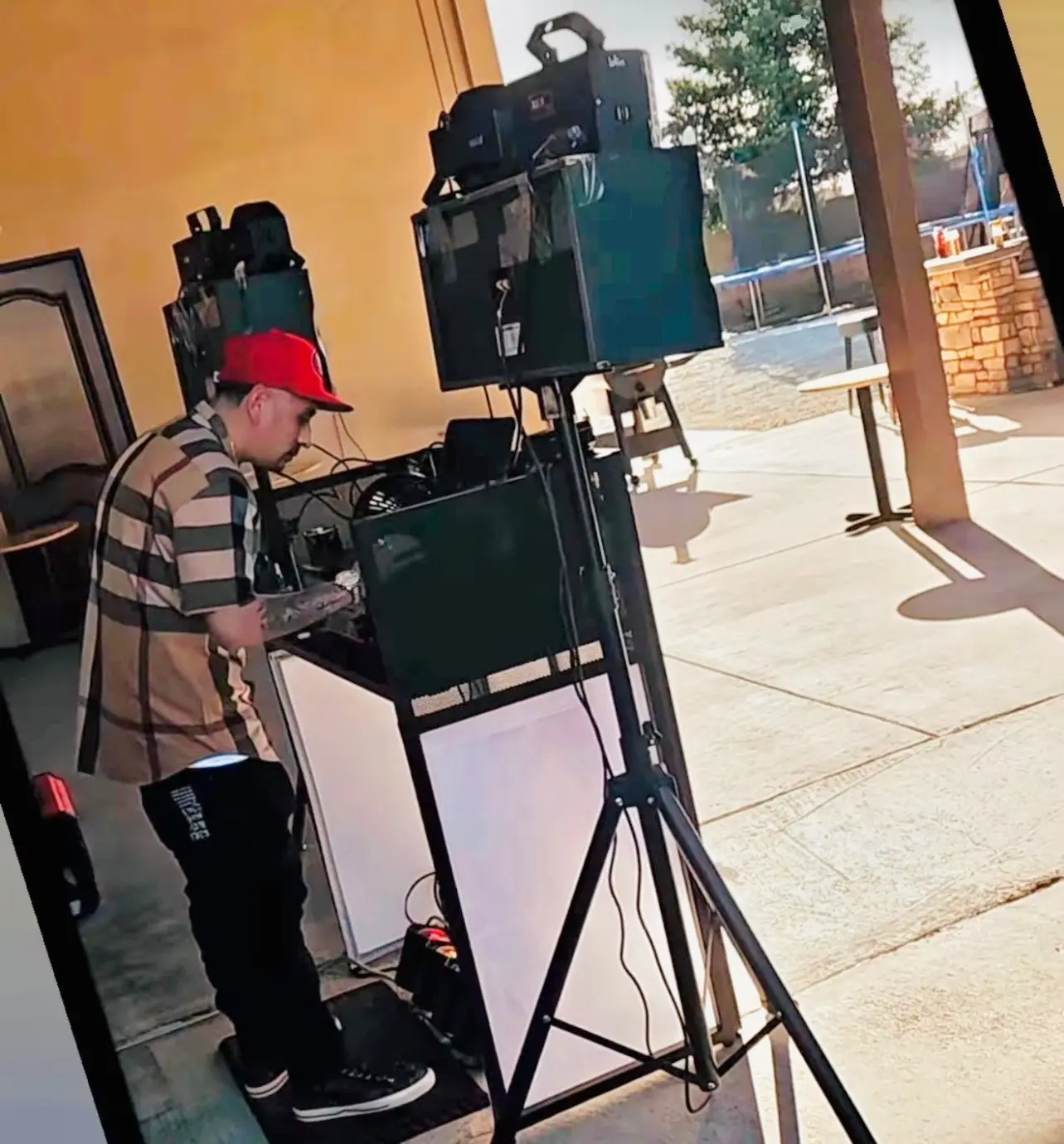 DJ JRV performing with his professional DJ booth and speaker setup in Stockton